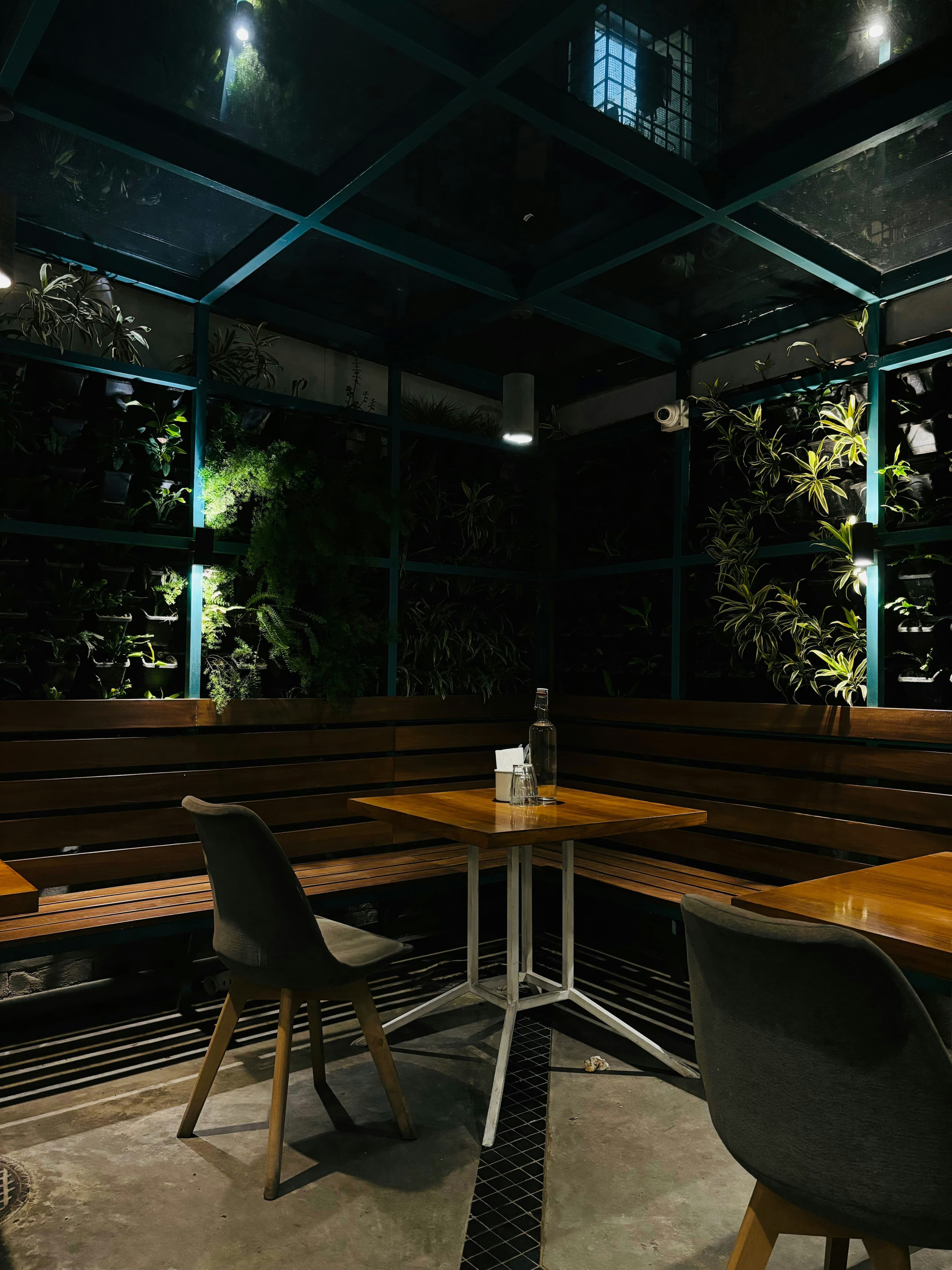 Outdoor smoking area with comfortable seating and ambient lighting